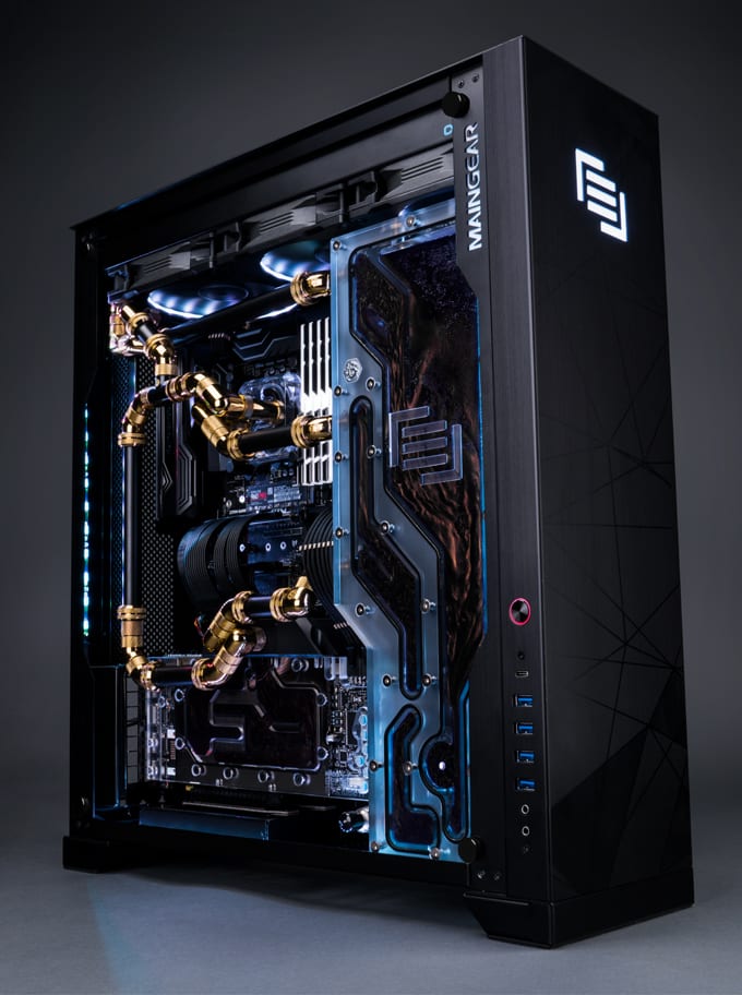 A Maingear F131 with black and gold tubing and fittings.